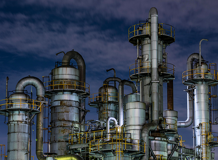Industrial plant with pipes and towers, rounded corners